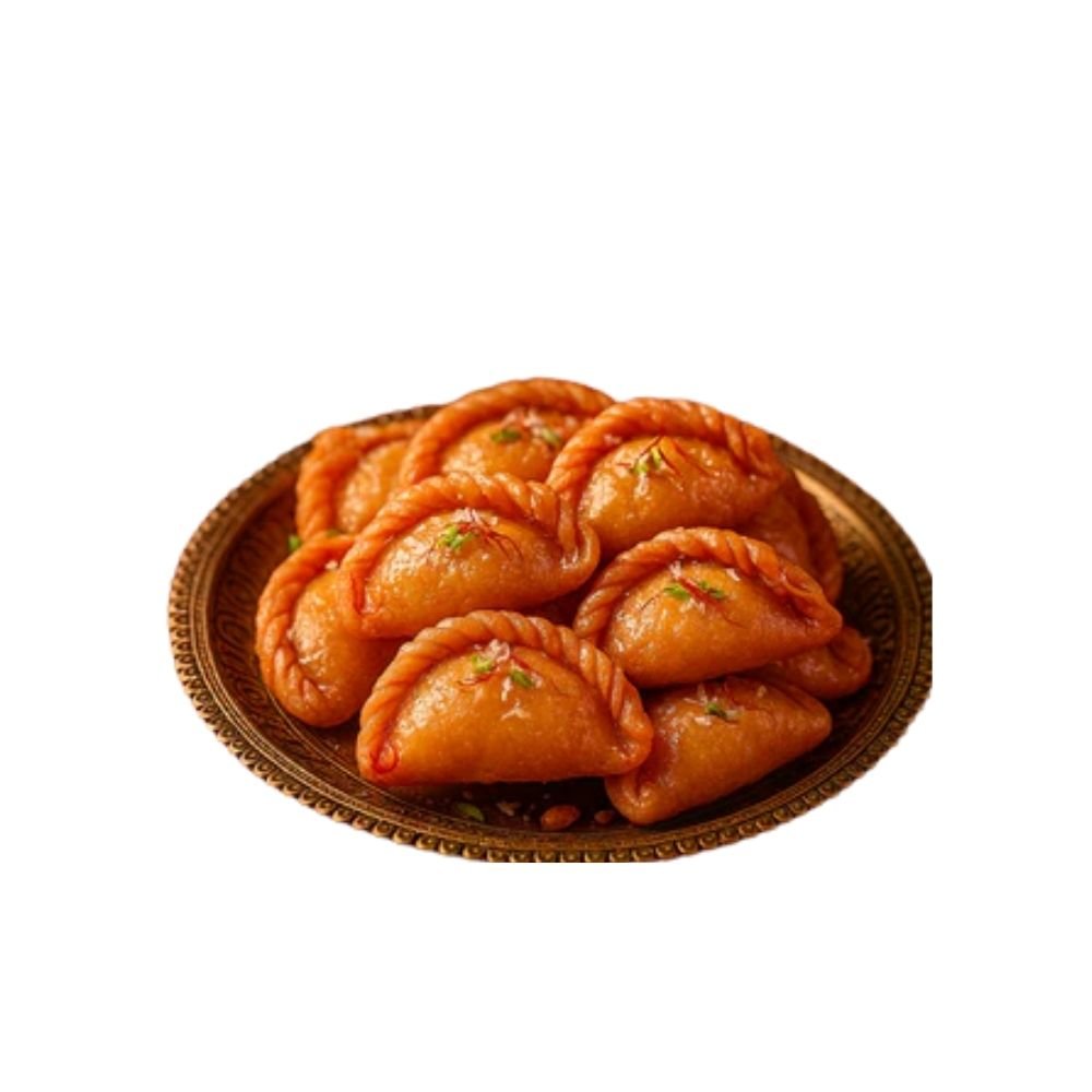 A royal South Indian sweet made for celebrations. Crispy on the outside, rich and flavorful on the inside, Chandrakala is a timeless delicacy filled with a delicious mix of khoya, nuts, and aromatic spices—deep-fried to golden perfection and soaked lightly in sugar syrup.