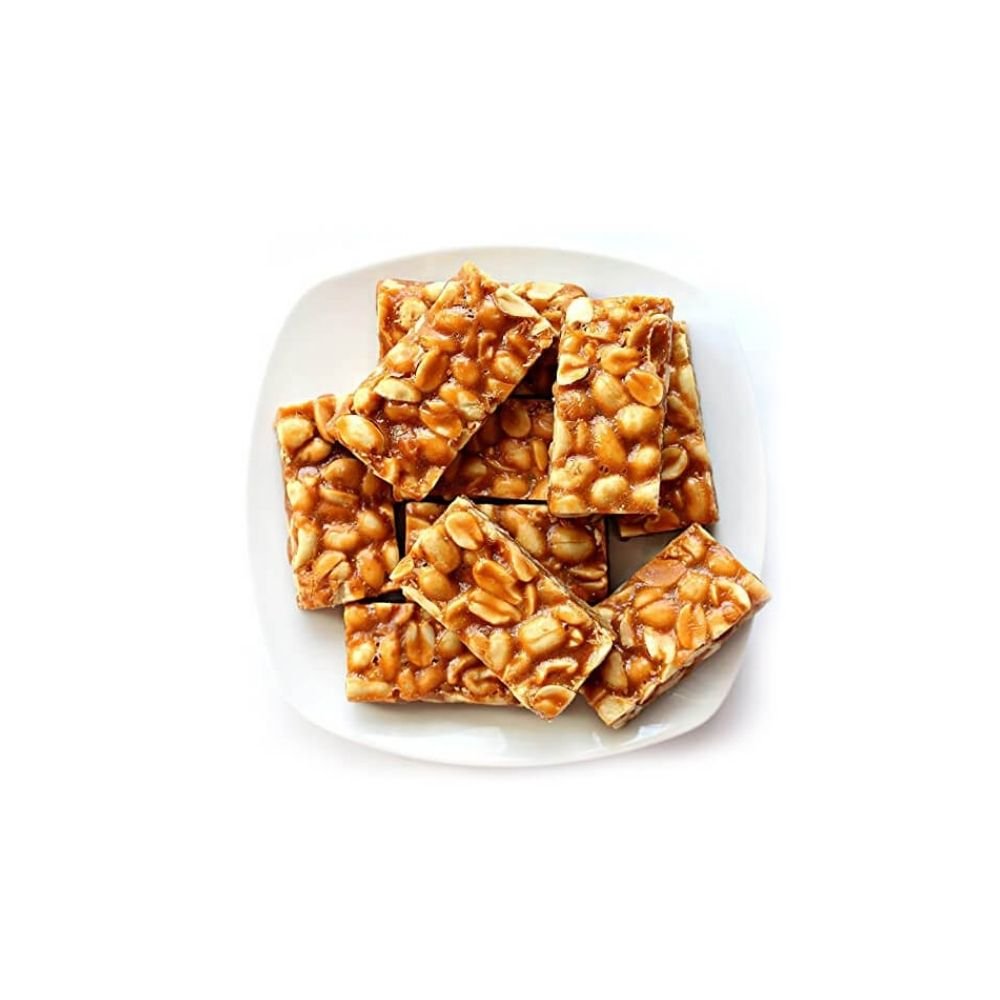 Kovilpatti Kadalai Mittai is a timeless Tamil Nadu sweet made using premium roasted groundnuts and pure jaggery. Prepared in the traditional Kovilpatti style, this groundnut burfi is crunchy, nutty, and perfectly sweet — just like how it’s made back home. No artificial flavours, no preservatives — only honest ingredients and authentic taste.